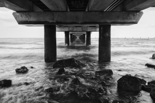 Black and white image of Shorncliffe Pier in Queensland, Australia.