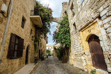 Fototapeta na wymiar Medieval arched street in the old town of Rhodes, Greece