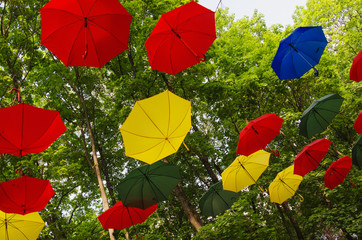 RUSSIA, MOSCOW REGION. Colorful umbrellas in the sky. Street decoration in the park