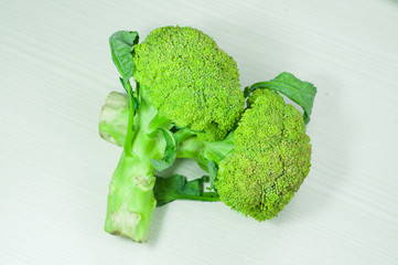 broccoli over white wood. broccoli isolated. vegetable green broccoli