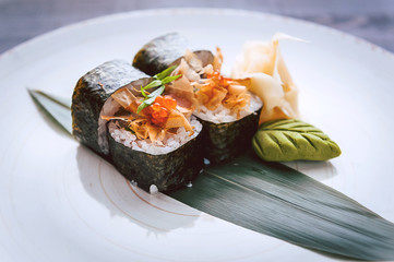 sushi on a black wooden surface
