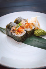 sushi on a black wooden surface