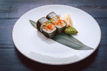 sushi on a black wooden surface