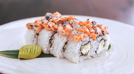 sushi on a black wooden surface