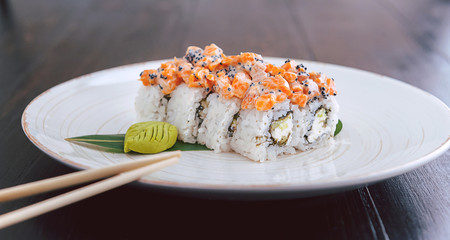 sushi on a black wooden surface