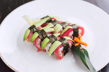 sushi on a black wooden surface