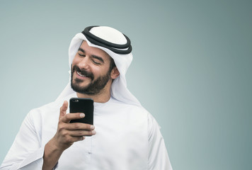 Arabian Businessman smiling on the phone..