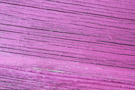cracked wooden plank, pink background