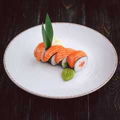 sushi on a black wooden surface