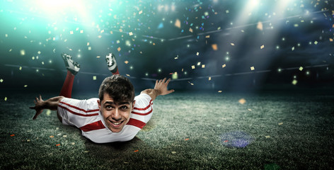 Football player in the stadium, joy of goal © efks