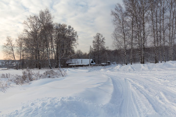 Fototapeta na wymiar Country landscape and white snow