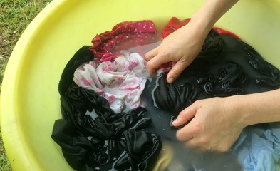 Woman hand washing clothes