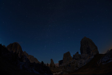 Night the starry sky above the mountains Cinque Torri ( Five Pillars), Dolomites, Italy