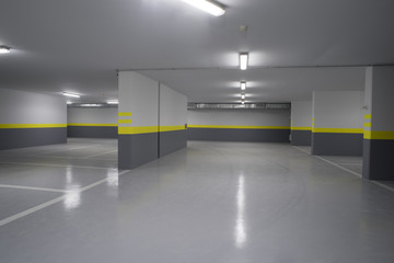 Empty parking garage underground interior in apartment or in supermarket..