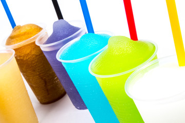 Colorful slushy, summer drink with straw