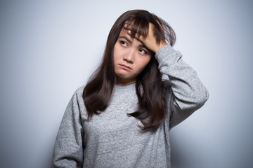 Woman has head ache on isolated background