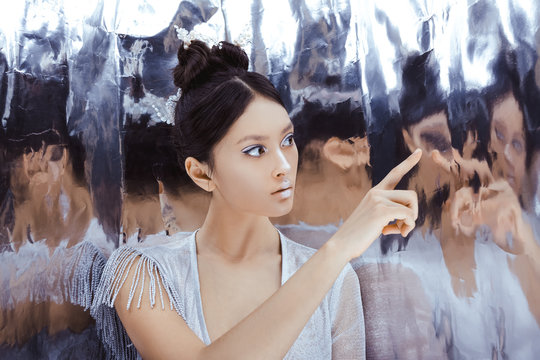 Shot of a futuristic young asian woman. - Powered by Adobe