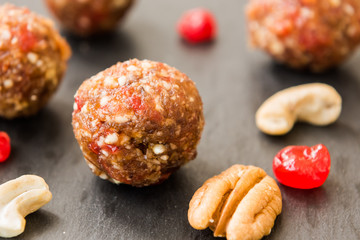 Balls made with cashews, cherries and dates