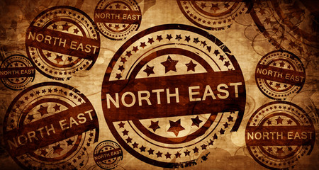 North east, vintage stamp on paper background