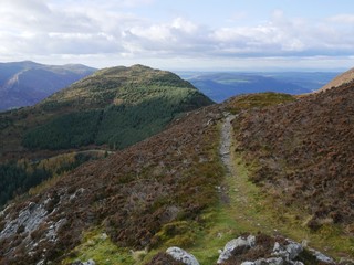 Footpath along a ridge heading towards another mountain lak