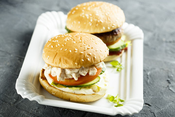 Chicken burger with cucumber and tomatoes