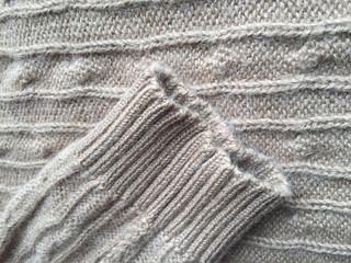 Beautiful crafted gray wool knitted background, natural soft surface