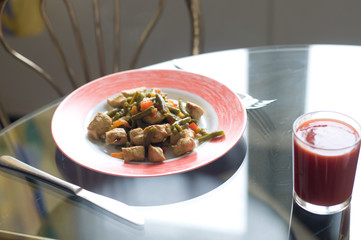 Chicken meat and vegetables on plate