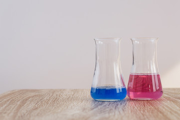 Laboratory glassware with liquids of different colors
