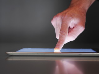 male hand touch digital tablet