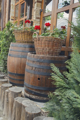 Scenery in the form of barrels and baskets of flowers in a sidew