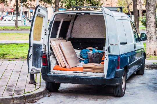 Work Van With The Door Open In The Back With Working Tools Inside