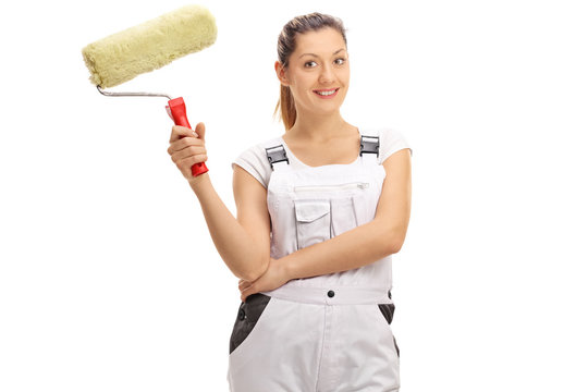 Cheerful female painter with a paint roller
