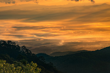 Misty morning with sunrise over forest mountain,Beautiful landscape at Doi Ang Khang,Chiang Mai,Thailand.