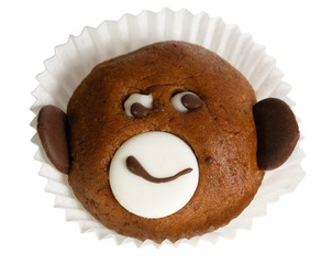 Cake in the form of a fun monkey face close up. The idea for a c