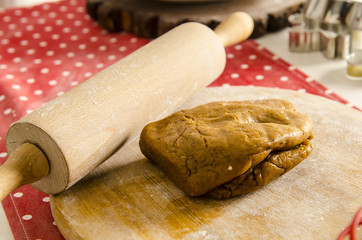 rolling pin and dounht on table in kitchen