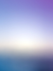 Rising of the sun high above the blue morning clouds