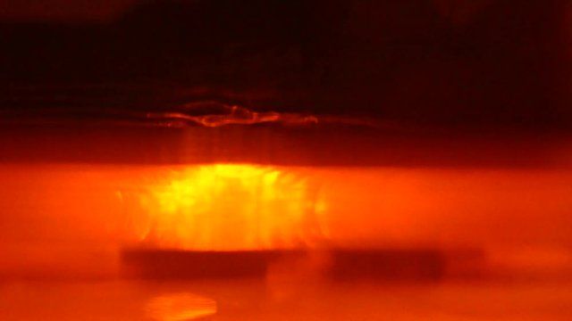 Stereolithography DPL 3d printer create detail and liquid drips, platform slowly move with liquid close-up. Progressive modern additive technology 3D printing, create scaled model by UV polymerization