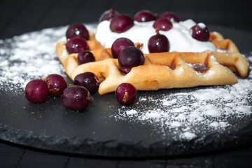 homemade Belgian waffles with berries, whipped cream