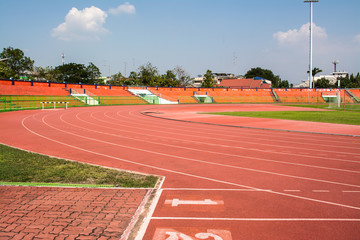 A stadium is a place for outdoor sports consists of a field or stage either partly or completely surrounded by a tiered structure designed to allow spectators to stand or sit and view the event.