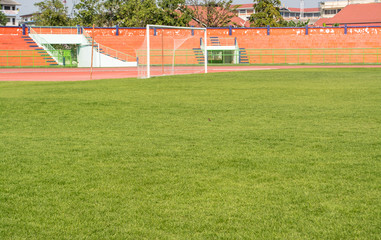 A stadium is a place for outdoor sports consists of a field or stage either partly or completely surrounded by a tiered structure designed to allow spectators to stand or sit and view the event.