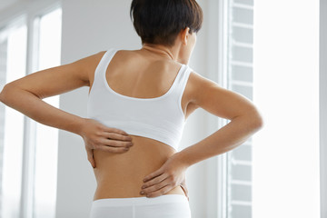 Fototapeta na wymiar Back Pain. Closeup Of Woman Body With Pain In Back, Backache
