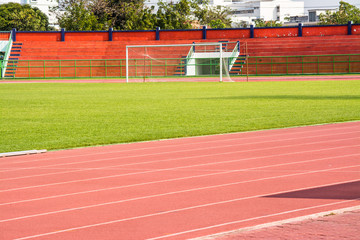 Fototapeta premium A stadium is a place for outdoor sports consists of a field or stage either partly or completely surrounded by a tiered structure designed to allow spectators to stand or sit and view the event.