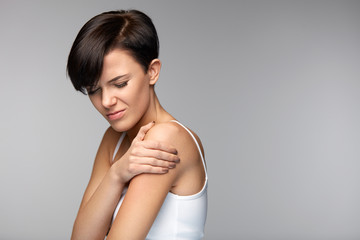 Body Pain. Beautiful Woman Feeling Pain In Shoulders And Arms