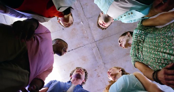 Group of business executives forming hands stack in office 4k