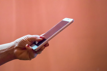 Close up of hands woman using cell phone.