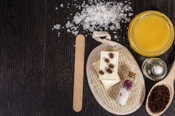 cosmetics for spa on dark background top view