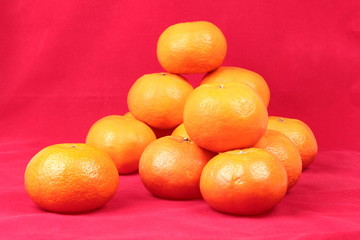 Golden orange on red background, to celebrate for Chinese festiv