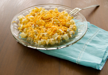 Festive salad with chicken breast, sweet corn, cheese and pineapple