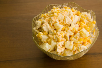 Festive salad with chicken breast, sweet corn, cheese and pineapple