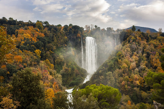 Marmore Falls surrounded with trees in autumn, Umbria, Italy